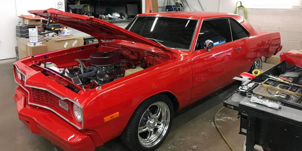 Image Of Red Car Being Repaired